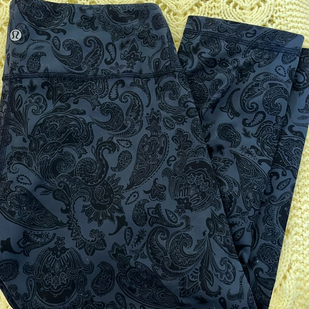 Lululemon workout capris. Navy blue with black paisley design.